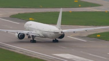 SOCHI, RUSSIA - AUGUST 03, 2022: Boeing 777 of Nordwind at the start of the Sochi airport runway. Airliner go to take off. Passenger flight departure