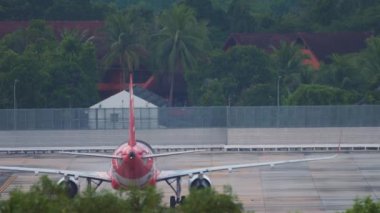 PHUKET, THAILAND - NOVEMBER 27, 2019: Jet plane Airbus A320, HS-BBG of AirAsia taxiing at Phuket Airport. Tourism and travel concept