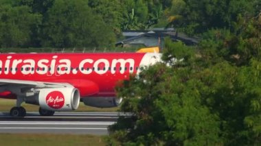 PHUKET, THAILAND - DECEMBER 02, 2018: Airplane Airbus A320 of AirAsia departure at Phuket International Airport, Thailand HKT.