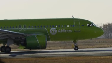 NOVOSIBIRSK, RUSSIAN FEDERATION - OCTOBER 20, 2021: Airbus A320 of S7 Airlines taxiing to runway start at Tolmachevo Airport. Tourism concept and journey