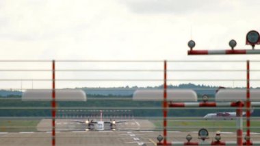 DUSSELDORF, GERMANY - JULY 23, 2017: Turboprop aircraft of Air Berlin taxiing after landing at Dusseldorf International Airport, Germany DUS