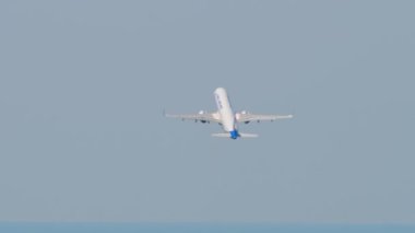 SOCHI, RUSSIA - JULY 28, 2022: Commercial jet plane of Ural Airlines takeoff and climb at Sochi International Airport. Tourism and travel concept.