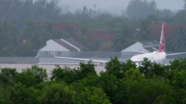 PHUKET, THAILAND - NOVEMBER 28, 2019: Passenger airplane of Airbus A330 Turkish Airlines on airfield at Phuket airport. Turkish Airlines flag carrier of Turkey. Tourism and travel concept