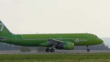 KAZAN, RUSSIA - AUGUST 05, 2022: Airbus A320 of S7 airlines accelerating before takeoff at Kazan airport. Jet airplane departure. Tourism and travel concept