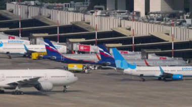 SOCHI, RUSSIA - JULY 31, 2022: Boeing 777 of Nordwind Airlines taxiing on the terminal at Sochi airport. Airliner on the airfield, ready to take off. Tourism and travel concept