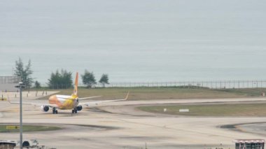 PHUKET, THAILAND - NOVEMBER 28, 2017: Boeing 737 of NOK Air on the airfield of Phuket airport. Airliner taxiing on the runway. Tourism and travel concept