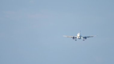 Front view, jet aircraft landing gear release and landing descent. Concept aviation, flight