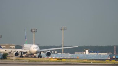 FRANKFURT AM MAIN, GERMANY - JULY 19, 2017: Airbus A330 of Air Namibia taxiing on the airfield of Frankfurt Airport, front view long shot. Tourism and travel concept