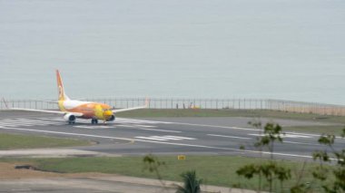 PHUKET, THAILAND - NOVEMBER 28, 2017: Boeing 737 of NOK Air on runway, ready to take off at Phuket airport. Tourism and travel concept