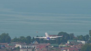 SOCHI, RUSSIA - AUGUST 03, 2022: Boeing 737 of Smartavia takeoff at Sochi airport. Passenger plane departure, rear view. Smartavia Russian airline. Tourism and travel concept