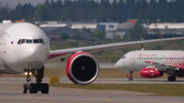 MOSCOW, RUSSIAN FEDERATION - JULY 29, 2021: Commercial jet plane of Royal Flight taxiing at Sheremetyevo airport, front view. View through the haze on the airfield. Tourism and travel concept