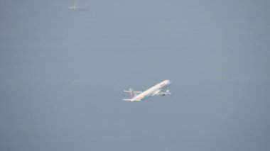 HONG KONG - NOVEMBER 7, 2019: Commercial jet plane Airbus of Dragonair departure at Chep Lap Kok, Hong Kong HKG. Tourism and travel concept.
