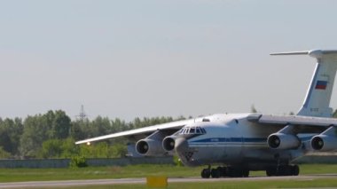 NOVOSIBIRSK, RUSSIAN FEDERATION - JUNY 12, 2022: Footage of transport aircraft IL 76 taxiing on runway at Tolmachevo airport. Il-76 Soviet heavy military transport aircraft