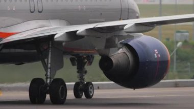 MOSCOW, RUSSIAN FEDERATION - JULY 28, 2021: Jet passenger aircraft Aeroflot rides on the taxiway, side view. Tourism and travel concept.