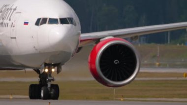 MOSCOW, RUSSIAN FEDERATION - JULY 29, 2021: Jet plane of Royal Flight taxiing at Sheremetyevo airport, front view. Haze on a hot day on the runway