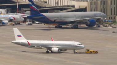 SOCHI, RUSSIA - AUGUST 03, 2022: Airbus A320 of Aeroflot Retro Livery in tow at Sochi airport on a summer day. Tourism and travel concept