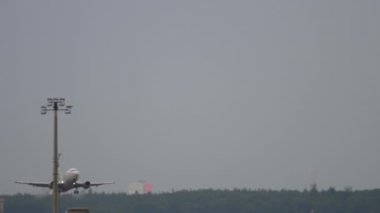 FRANKFURT AM MAIN, GERMANY - JULY 19, 2017: Airplane of Air Baltic Latvian airline takeoff, departure at Frankfurt airport. Tourism and travel concept