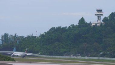 PHUKET, THAILAND - NOVEMBER 28, 2019: Airbus A350 of Qatar Airways taxiing on the runway at Phuket airport. Tourism and travel concept, air flight