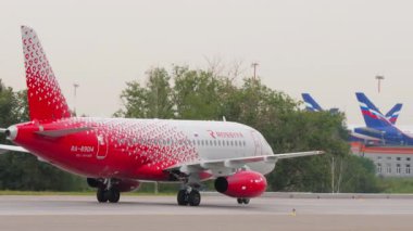 MOSCOW, RUSSIAN FEDERATION - JULY 28, 2021: Airplane of Rossiya taxiing at Sheremetyevo Airport SVO. Footage of aircraft at airport. Jet commercial plane on the airfield. Tourism and travel concept