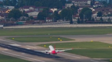 SOCHI, RUSSIA - JULY 31, 2022: Rear view Boeing 737 of Izhavia takeoff, departure at Sochi airport. Tourism and travel concept. Airliner flies away