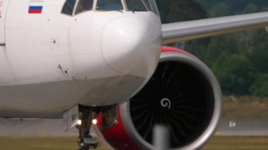 MOSCOW, RUSSIAN FEDERATION - JULY 29, 2021: Jet plane of Royal Flight taxiing at Sheremetyevo airport, front view. Aircraft engine and nose, taxiing. Concept aviation and tourism