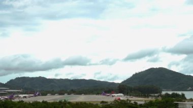 PHUKET, THAILAND - DECEMBER 02, 2016: Long shot of passenger jet landing at Phuket airport. Airline arrives