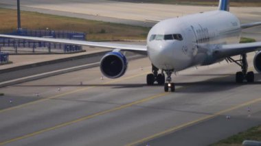 FRANKFURT AM MAIN, GERMANY - JULY 19, 2017: Jet plane Boeing 767 of Condor taxiing after landing at Frankfurt Airport. Tourism and travel concept