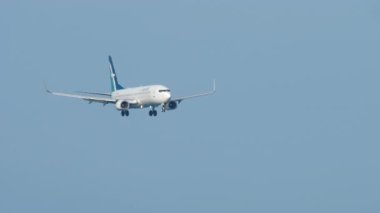 PHUKET, THAILAND - NOVEMBER 30, 2018: Boeing 737 of SilkAir landing at Phuket airport. SilkAir is a Singaporean airline. Tourism and travel concept