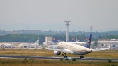 FRANKFURT AM MAIN, GERMANY - JULY 20, 2017: Boeing 777 of Saudi Arabian Airlines landing and braking at Frankfurt Airport. Tourism and travel concept