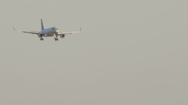 Footage of a jet plane approaching landing. Unrecognizable airliner is flying