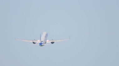 NOVOSIBIRSK, RUSSIAN FEDERATION - JUNE 12, 2022: Airbus A321 of Ural Airlines fly away at Tolmachevo airport. Jet airplane departure, takeoff, rear view