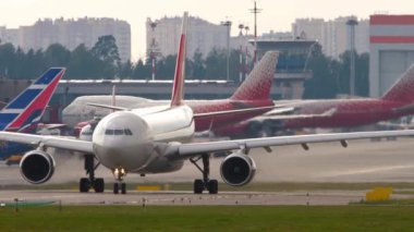 MOSCOW, RUSSIAN FEDERATION - JULY 30, 2021: Commercial airplane Airbus A330 of Nordwind Airlines taxiing at Sheremetyevo Airport Moscow SVO. Tourism and travel concept