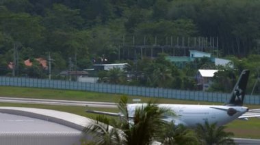 PHUKET, THAILAND - NOVEMBER 28, 2019: Airbus A330 Thai Airways with Star Alliance livery taxiing at Phuket Airport. Tourism and travel concept