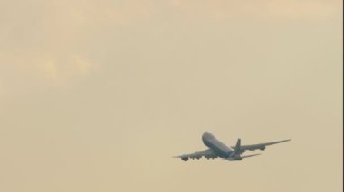 MOSCOW, RUSSIAN FEDERATION - JULY 30, 2021: Boeing 747 of AirBridgeCargo climbing, rear view long shot. Four-engine double-deck airliner departure, takeoff