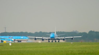 AMSTERDAM, THE NETHERLANDS - JULY 27, 2017: Huge plane Boeing 747 of KLM Airlines accelerates to take off. Passenger flight departing at Schiphol Airport, Amsterdam