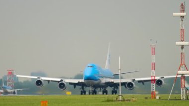 AMSTERDAM, THE NETHERLANDS - JULY 27, 2017: Four-engine double-deck aircraft Boeing 747 of KLM Airlines taking off. Passenger flight departing at Schiphol Airport, Amsterdam