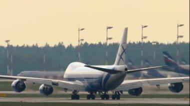 MOSCOW, RUSSIAN FEDERATION - JULY 30, 2021: Boeing 747 AirBridgeCargo departure at Sheremetyevo airport, Moscow. Freight carrier speed up before takeoff at dawn or dusk