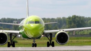 NOVOSIBIRSK, RUSSIAN FEDERATION - JULY 15, 2022: Civil plane of S7 Airlines taxiing on the runway at Tolmachevo airport. Aircraft on the taxiway. Tourism and travel concept