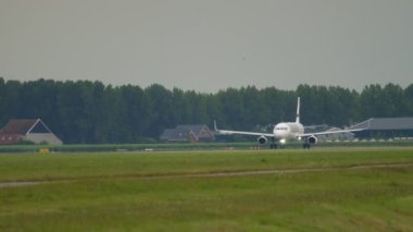 AMSTERDAM, THE NETHERLANDS - JULY 24, 2017: Commercial jet plane Airbus A320 of Finnair speed up before takeoff at Amsterdam Airport. Tourism and travel concept