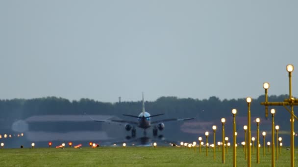Rear View Airplane Braking Landing Smoke Landing Lights Illuminate Runway — Stockvideo