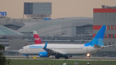 MOSCOW, RUSSIAN FEDERATION - JULY 28, 2021: Lowcost Boeing 737 of Pobeda taxiing on the runway at Sheremetyevo airport SVO. Tourism and travel concept, air flight