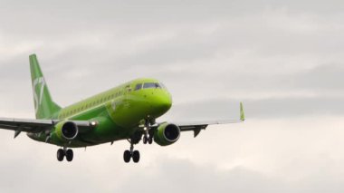 NOVOSIBIRSK, RUSSIAN FEDERATION - JULY 15, 2022: Embraer E170, RA-02745 of S7 Airlines landing. Airplane flies. Tourism and travel concept