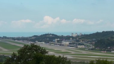 Timelapse at the airport. Panoramic view of the airfield. Aircraft on the runway, takeoffs and landings, taxiing