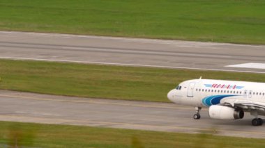 SOCHI, RUSSIA - AUGUST 03, 2022: Airbus A320-232, RA-73695 Yamal Airlines taxiing to the runway at Sochi airport, side view. Passenger flight, airplane view