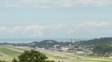 Panoramic footage of time-lapse airport, traffic. Aircraft on the runway, takeoffs and landings, taxiing. Tourism and travel concept