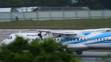 PHUKET, THAILAND - NOVEMBER 28, 2019: ATR-72 Bangkok airways departure at Phuket international airport, Thailand. Tourism and travel concept, air flight