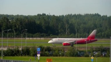 SAINT PETERSBURG, RUSSIA - JULY 26, 2022: Sukhoi Superjet 100-95B, RA-89178 of Rossiya rides on the taxiway at Pulkovo airport