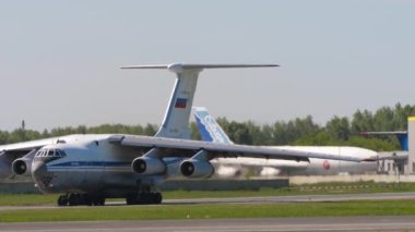 NOVOSIBIRSK, RUSSIAN FEDERATION - JUNY 12, 2022: Footage of transport aircraft IL 76 taxiing on runway at Tolmachevo airport. Il-76 Soviet heavy military transport aircraft