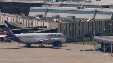 SOCHI, RUSSIA - JULY 28, 2022: Commercial passenger aircraft Airbus A350 of Aeroflot arrived at Sochi airport and is taxiing to the terminal. Tourism and travel concept