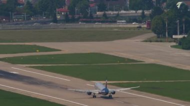SOCHI, RUSSIA - JULY 28, 2022: Rear view of airplane of Aeroflot takeoff at Sochi International Airport. Aviation traffic. Tourism and travel concept